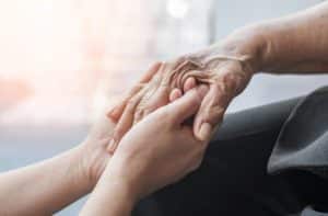 holding a seniors hand