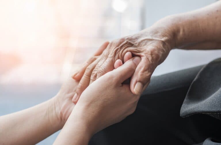 holding a seniors hand