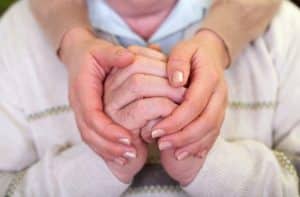 holding seniors-hands