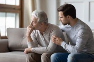 son talking to senior father