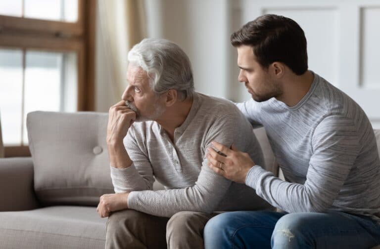 son talking to senior father
