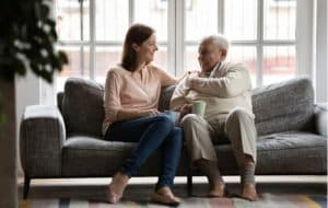 woman talking to senior father