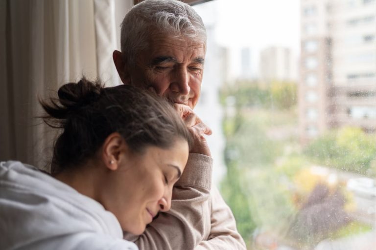 Woman comforts man with early onset Alzheimer’s disease