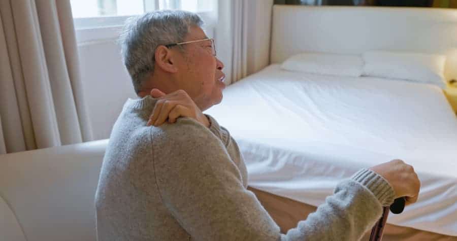 Elderly individual with neck pain